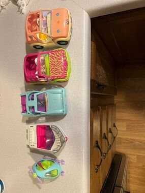 Lot of 5 polypocket vehicles (3 cars, 1 boat, and helicopter)